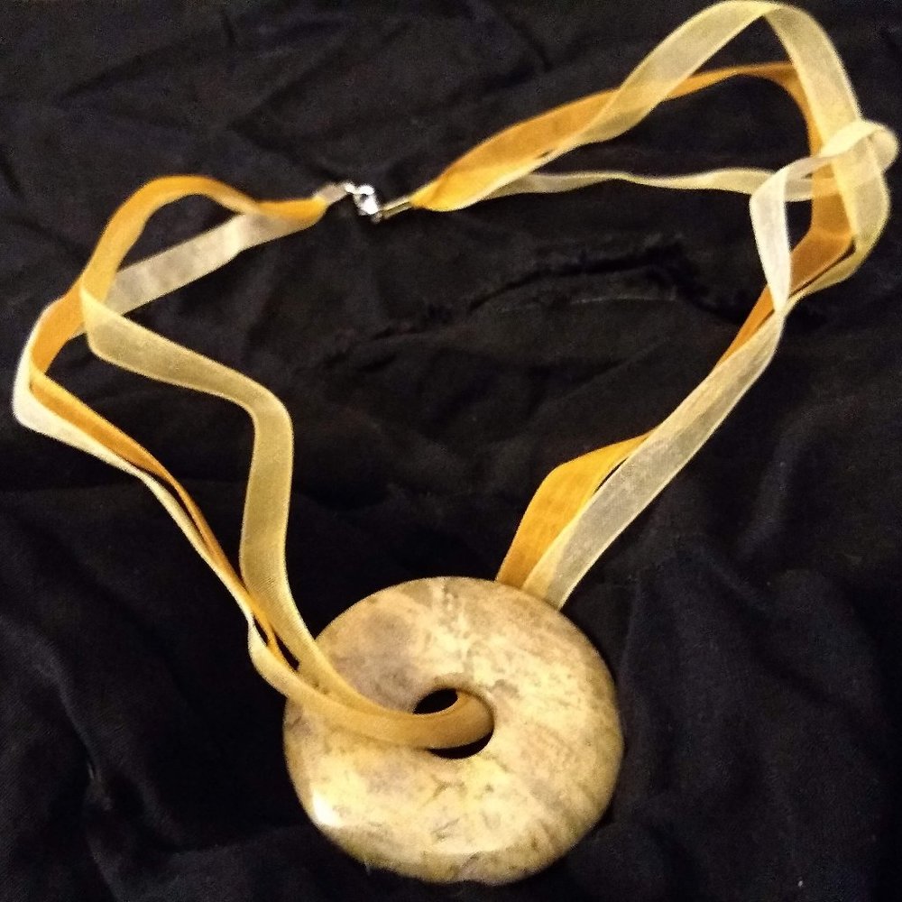 Stone pendant on ribbon necklace